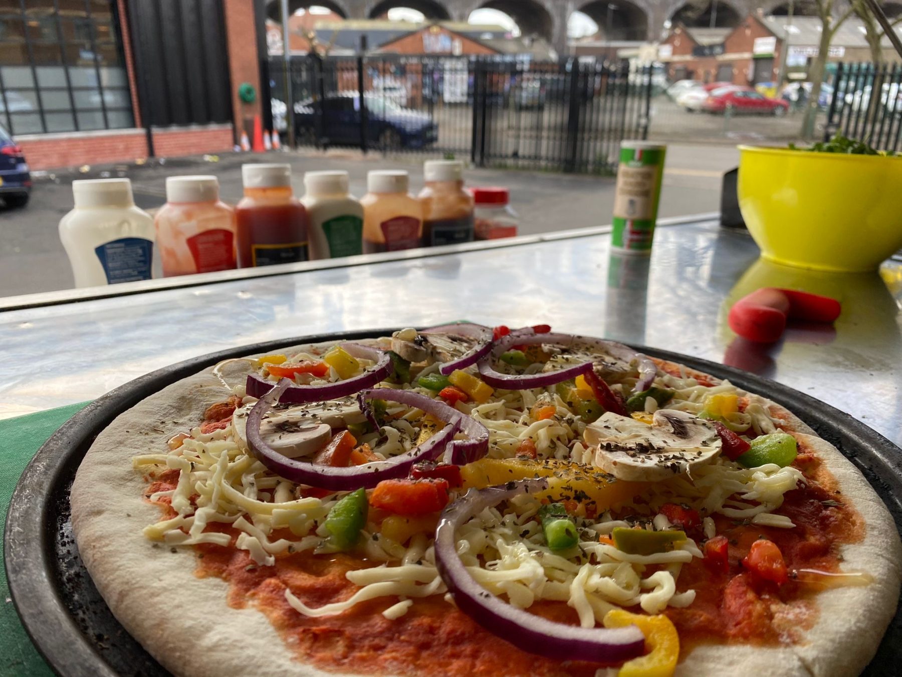 Fresh Pizza Being Prepared in Mobile Van